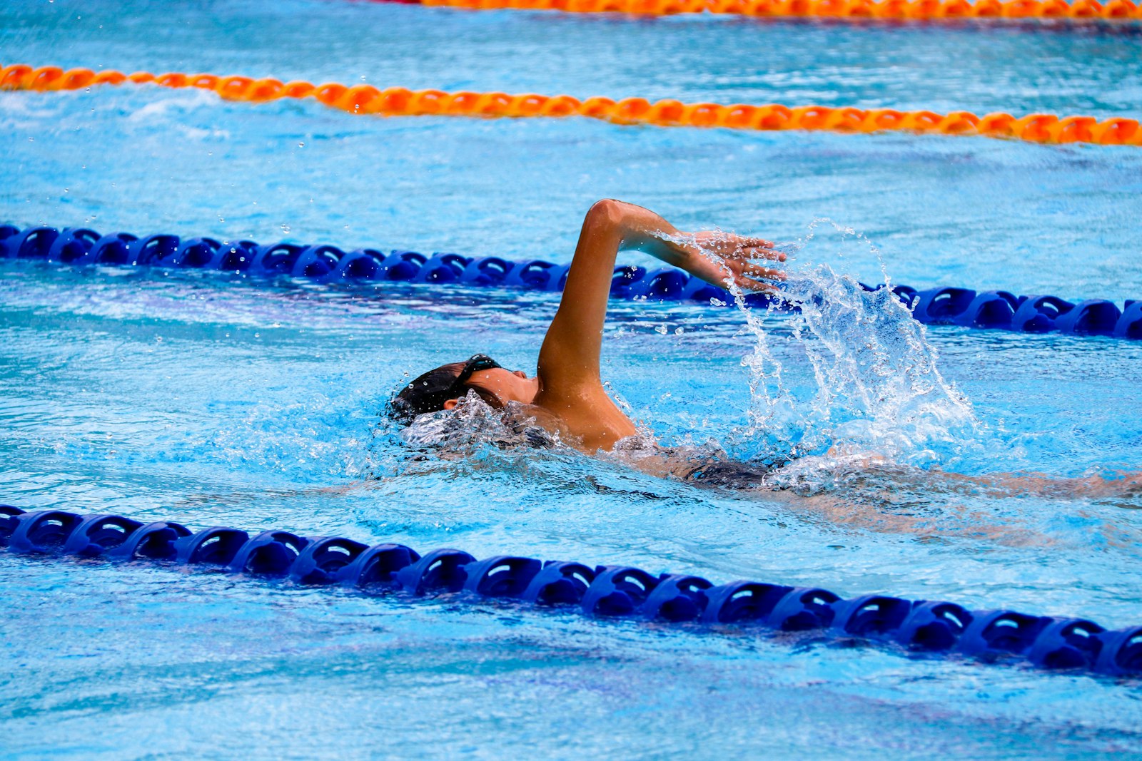 Swimmer doing front crawl in a lane